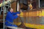 Removing the rusted sheets from the sleeper Car