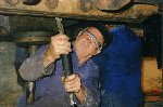 Merv using the needle gun to remove rust and dirt